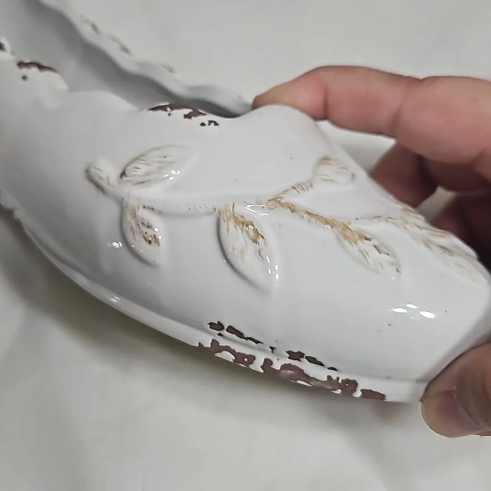Decorative ceramic ballet shoe vase with vine design